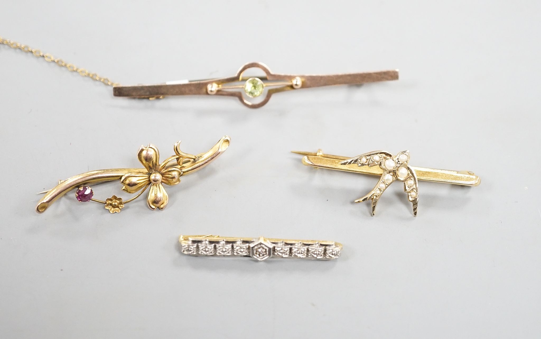 Three assorted 9ct and gem set bar brooches, including a swallow brooch, gross 5.9 grams and one other yellow metal and diamond chip set bar brooch, gross 1.7 grams.